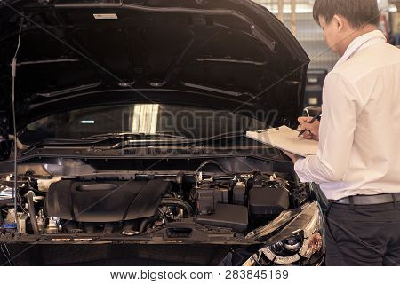 This Career Man Saleman Business Inspection Writing Note On Notepad Or Book, Paper With Car Blurry B