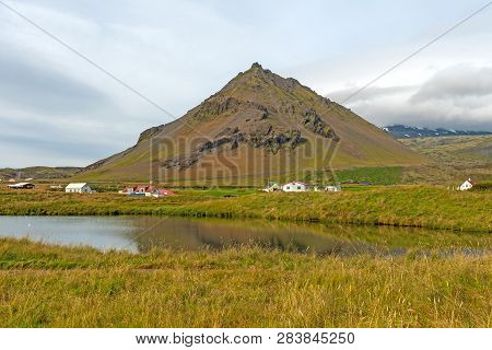 Scenic Hills And Wetlands By The Icelandic Village Of Arnarstapi