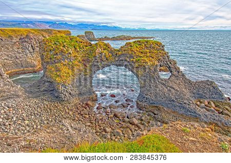 Dramatic Sea Arch On A Remote Coast Near Arnarstapi, Iceland
