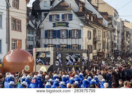 Basel, Switzerland - March 10, 2014: Spectators Watching The Tradtional Carnival Parade With Dressed