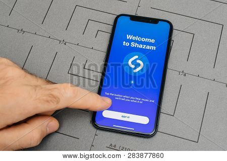 Paris, France - Nov 9, 2017: Man Hand Finger Pointing Open The Shazam App On The Latest Iphone X Sma