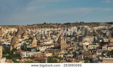 GOREME, TURKEY - JULY 28, 2007: View to Goreme town in Cappadocia. It is the center of Goreme national park listed as UNESCO World Heritage since 1985