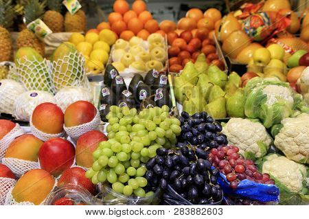 Green Black Red Berries Of Grapes, Mango, Pears, Apples, Pineapple, Melon Are On The Market For Sale