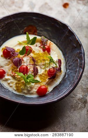 Buratta with caviar and cherry tomatoes