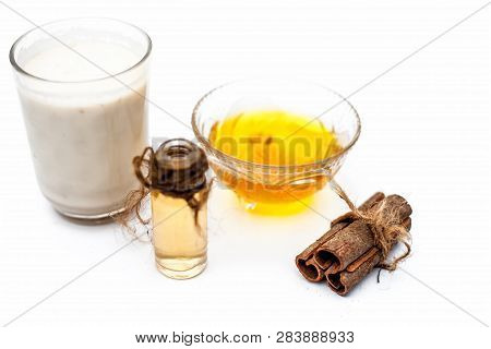 Close Up Of Popular Indian & Asian Winter Drink Isolated On White I.e Honey Milk Or Shahad Ka Dudh I