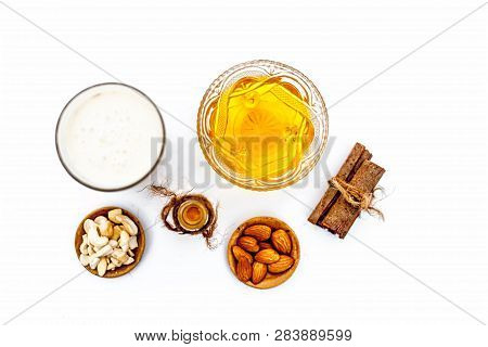 Close Up Of Popular Indian & Asian Winter Drink Isolated On White I.e Honey Milk Or Shahad Ka Dudh I