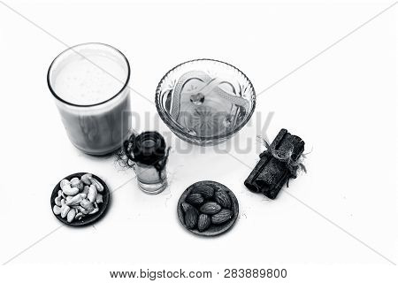 Close Up Of Popular Indian & Asian Winter Drink Isolated On White I.e Honey Milk Or Shahad Ka Dudh I