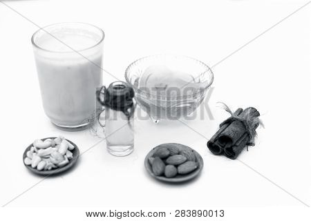 Close Up Of Popular Indian & Asian Winter Drink Isolated On White I.e Honey Milk Or Shahad Ka Dudh I