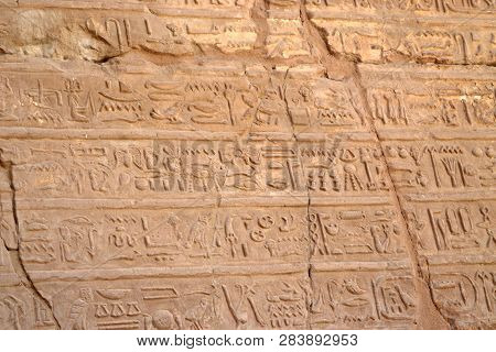 Egyptian Hieroglyphs, Symbols And Signs On A Stone Wall In Karnak Temple. Bass-relief.