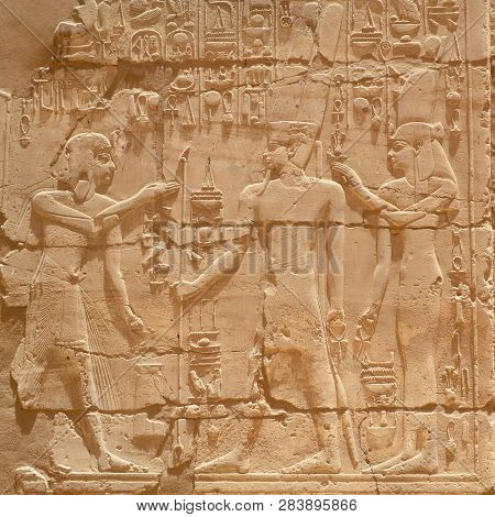 Egyptian Hieroglyphs, Symbols And Signs On A Stone Wall In Karnak Temple. Elements And Details Of Ba