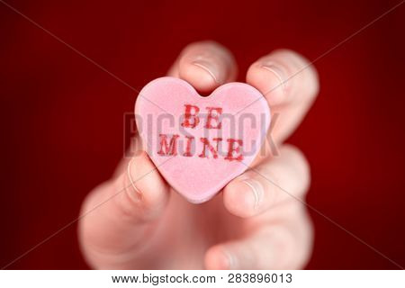 Hand holding converstation heart - Be Mine