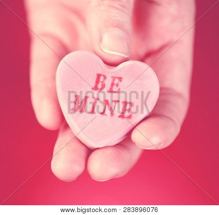 Hand holding converstation heart - Be Mine