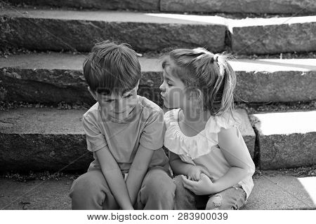 Childhood First Love. Summer Holiday Vacation. Small Girl And Boy On Stair. Relations. Couple Of Lit