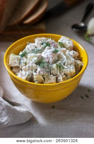 Traditional Cold Potato Salad With Onions And Herbs On A Linen Tablecloth Background. Rustic Style.