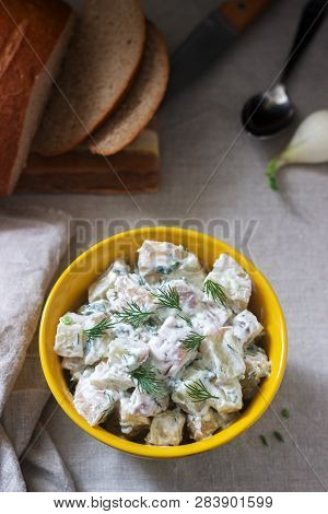 Traditional Cold Potato Salad With Onions And Herbs On A Linen Tablecloth Background. Rustic Style.