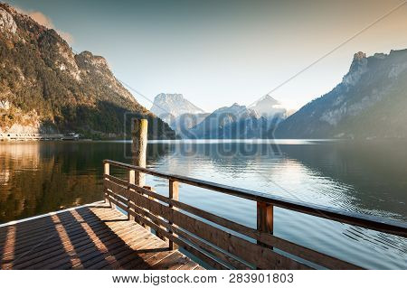 Wooden Pier On Traunsee Lake In Alps Mountains; Austria. Autumn Landscape