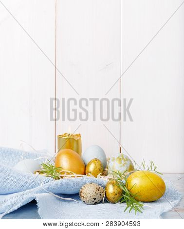 Easter Background With Easter Eggs And Spring Flowers. Top View With Copy Space