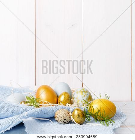 Easter Background With Easter Eggs And Spring Flowers. Top View With Copy Space