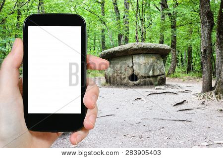 Travel Concept - Tourist Photographs Of Large Shapsugsky Dolmen In Abinsk Foothills Of Caucasus Moun