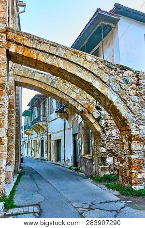 Old street in Larnaca under ancient buttresses of The Great mosque, Cyprus