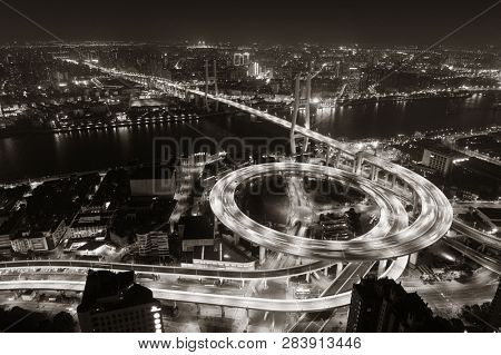 Shanghai Nanpu Bridge over Huangpu River with busy traffic in China.