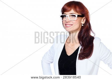 A portrait of a beautiful woman wearing classic clothes and posing over the white background in the studio. Beauty, fashion, business.