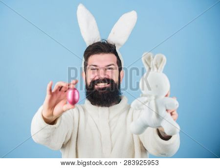Funny Bunny With Beard And Mustache Hold Pink Egg. Bearded Man Wear Bunny Ears. Egg Hunt. Look What 
