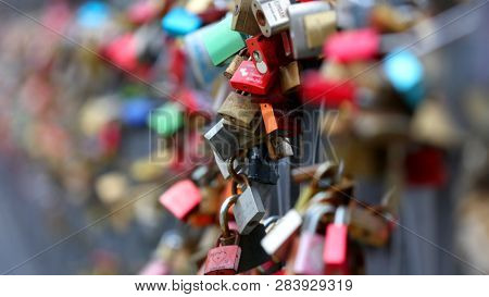 FRANKFURT AM MAIN, GERMANY - Mar 17, 2018: Love locks at famous Eiserner steg over the river Main. The Eiserner Steg is a pedestrian bridge only built in 1868.
