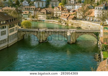 Bern, Switzerland. View Of The Old City Center And Nydeggbrucke Bridge Over River Aare.