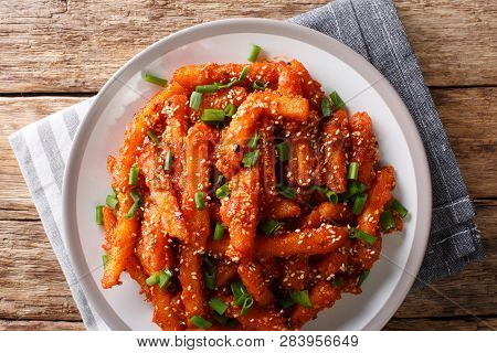 Crispy Honey Chilli Potatoes Delicious Spicy Snack On A Plate Close-up. Horizontal Top View