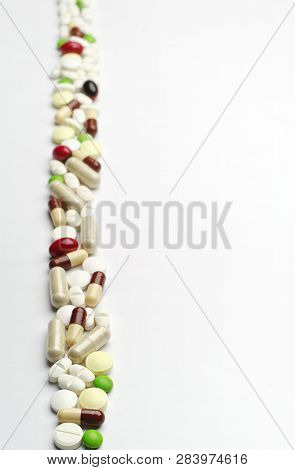 Background With Different Pills, Arranged Vertically. Conceptual Phono