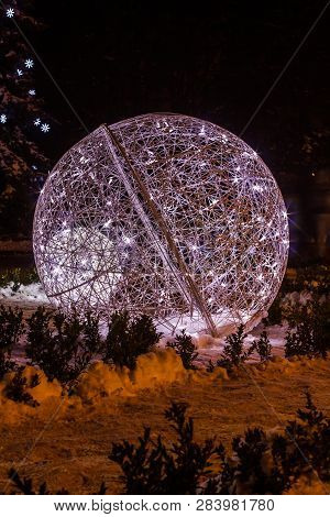 White Glowing Fiber Ball For The New Year Is Standing On The Snow Outside