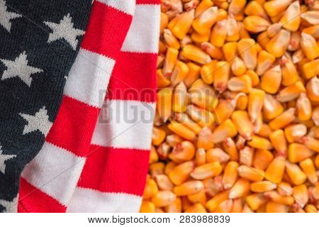 Folded Usa Flag Over Corn Grain Kernels After A Good Harvest Of Crops