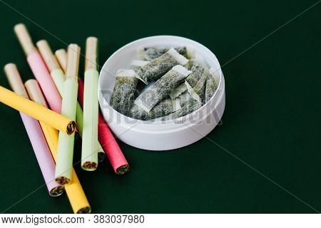 Round Box Of Snus With Multicolored Cigarettes Cigarette Substitute, Nicotine Pouches.