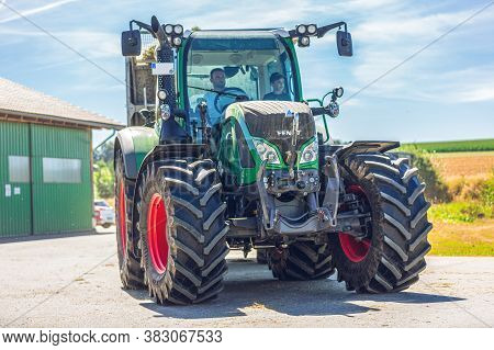 Bavaria / Germany - August 20, 2020: Fendt Tractor With A Loader Wagon, Working On A Biogas Plant