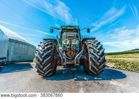 Bavaria / Germany - August 20, 2020: Fendt Tractor With A Loader Wagon, Working On A Biogas Plant