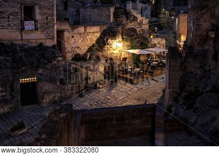 Matera, Italy - September 14, 2019: Evening View Of The City Of Matera, Italy, With The Colorful Lig