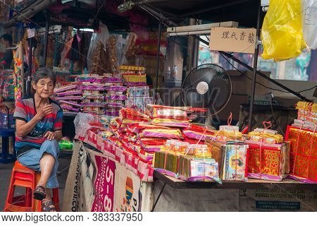 Bukit Mertajam, Penang/malaysia - Aug 13 2016: A Hawker Sit Beside The Joss Paper And Joss Stick.