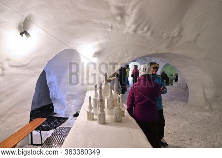 Mayrhofen, Austria - March 13, 2019: People Visit Ahorn White Lounge, A Bar Made Of Ice In Mayrhofen