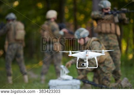 Modern Warfare Soldiers Squad are Using Drone for Scouting and Surveillance During Military Operation in the Forest.