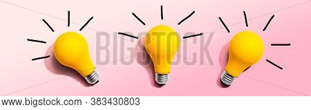 Three Yellow Light Bulbs - Flat Lay From Above