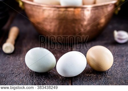 Colorful Caipira Egg Typical Of Brazil, In Copper Pot, On Rustic Wooden Background