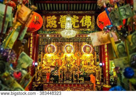 Bangkok Thailand - March 15, 2017 :  Golden Buddhas Seated At Wat Mangkon Kamalawat (wat Leng Noei Y