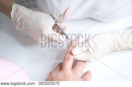 Cuticle Removal With Scissors. Nail Care, Manicure In The Salon
