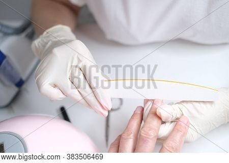 Professional Nail Care, Manicure Professional Nail Care, Manicure In A Beauty Salon. Hands Of A Mast