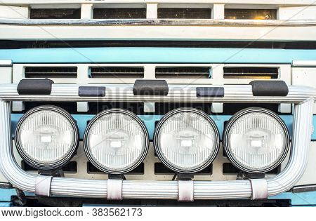 Tractor Truck Radiator Grid Protected With Bumper-mounted Offroad Spotlights. Blue Arctic Painted