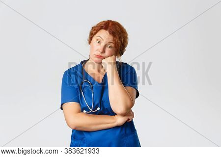 Medicine, Healthcare And Coronavirus Concept. Bored And Tired Middle-aged Female Retirement Home Nur