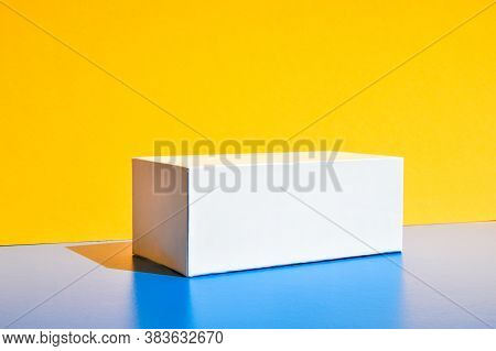 White Box. Drugs Box Mock-up. Mockup. Copy Space. Yellow And Blue Creative Minimalism Isometric Back