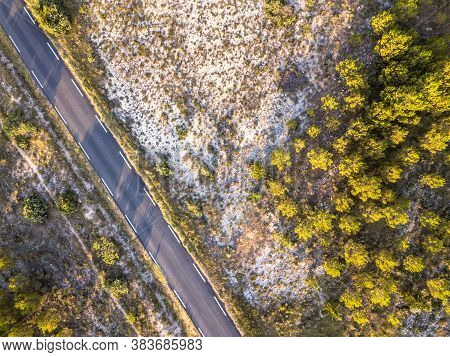 Road Through Sparsely Vegetated Barren Landscape In Cevennes Near Ganges, Occitania, France