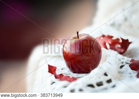 Ripe Red Apple And Red Oak Leaves Lie On A White Woolen Blanket, On A Wooden Chair, Close Up, Copysp
